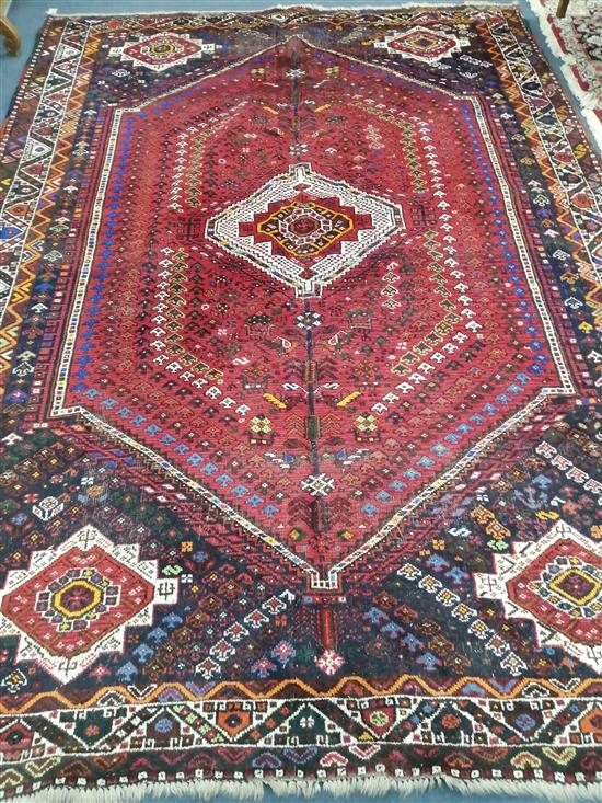 A Shiraz carpet 310 x 216cm